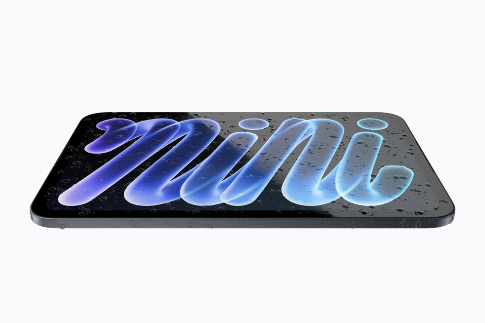 iPad mini lying flat covered in water droplets, showing its IP67 rating