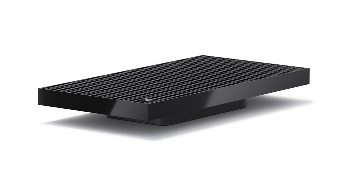Surface RTX Spark Dev Box, a flat black mini PC with a perforated top