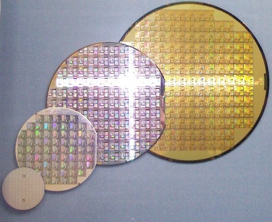 A stack of silicon wafers of varying diameters, the raw material for advanced chips