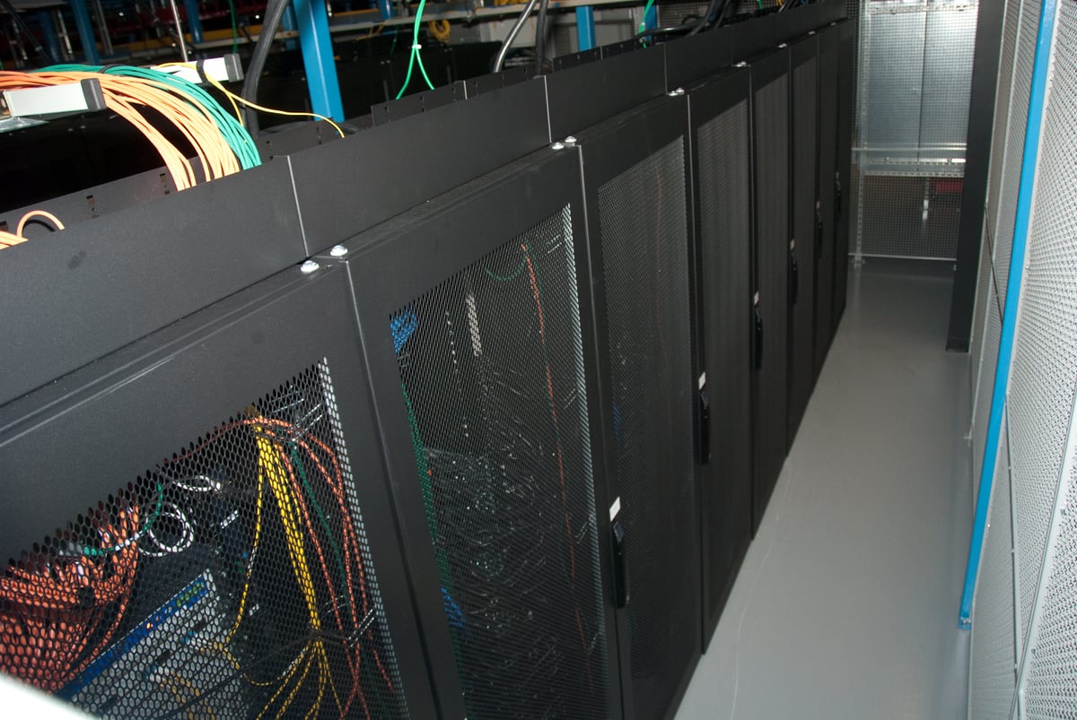 Rows of black server racks in Wikimedia's eqiad data center